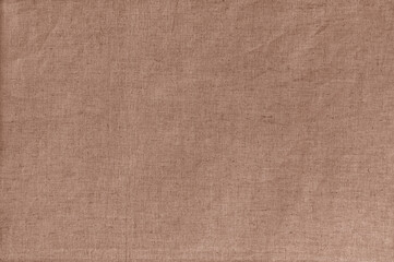 Plain linen fabric textured background in soft warm brown trendy color of 2025 year