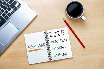2025 Happy New Year Resolution Goal List and Plans Setting - Business office desk with notebook written about plan listing of new year goals and resolutions setting. Change and elation concept.