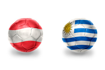 Obraz premium football balls with national flags of austria and uruguay ,soccer teams. on the white background.