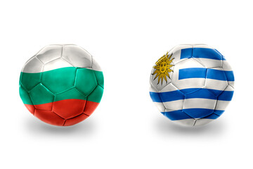 Obraz premium football balls with national flags of bulgaria and uruguay ,soccer teams. on the white background.