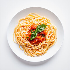 spaghetti with tomato sauce and basil in white plate