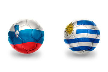 Obraz premium football balls with national flags of slovenia and uruguay ,soccer teams. on the white background.