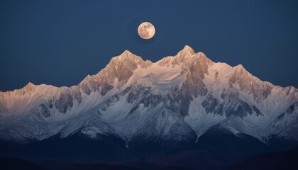A breathtaking mountain landscape at night, with snow-capped peaks illuminated by a full moon against a deep blue sky.
