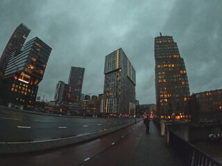 Rotterdam Netherlands, March 19 2023: Huge skyscrapers in Rotterdam. Tall and futuristic buildings in the center of a large European city. Cityscape with high towers in sunny weather