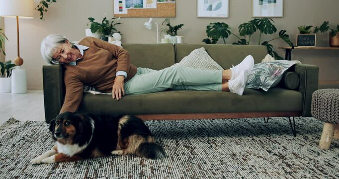 Senior, happy woman and relax with dog on sofa for love, animal care or bonding together at home. Elderly, female person or pet owner lying on couch with canine for retirement in living room at house