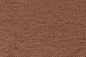 Knitted fabrics. Knitted background in fashionable color 2025 mocha mousse