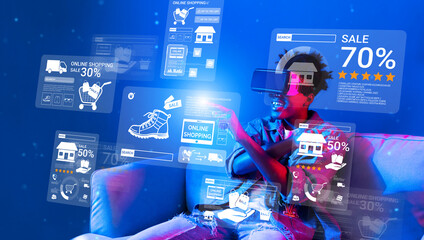 African teenager with VR glass looking at screen display discount. Person sitting at sofa while...