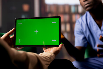 African american male nurse opening up in a counseling session, therapist uses a green screen display. Surgeon assistant experiencing post traumatic stress disorder, patient loss.