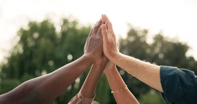 Celebration, high five and friends with success, group and support for achievement, unity and volunteers. Hands, outdoor and victory for community service, accomplishment and solidarity for people