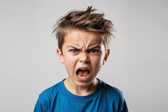 A fearfully angry boy wearing blue shouts with intense expression.