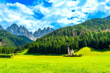 St. Magdalena church with odle mountains shining in val di funes, dolomites, italy