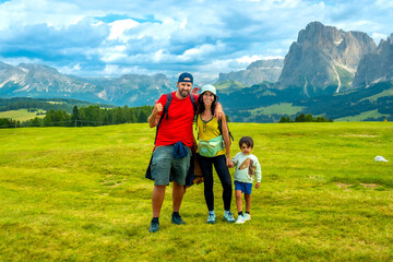 Family hiking in the dolomites, alpe di siusi in summer