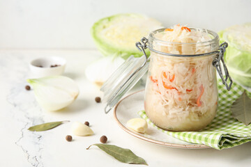 Composition with tasty sauerkraut and cabbage on table