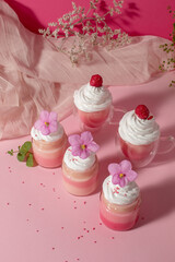 Pink cream with whipped cream and violets. Sweet love food