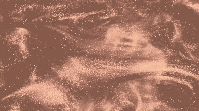 Abstract elegant, detailed mocha colored, pastel brown glitter particles flow with shallow depth of field underwater. Holiday magic shimmering luxury background. Year color concept 2025
