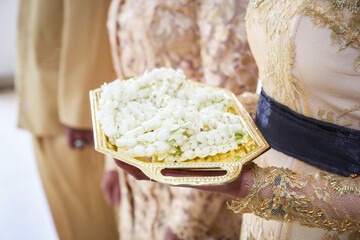 Javanese Jasmine flower necklace on tray for welcoming the groom and his family 