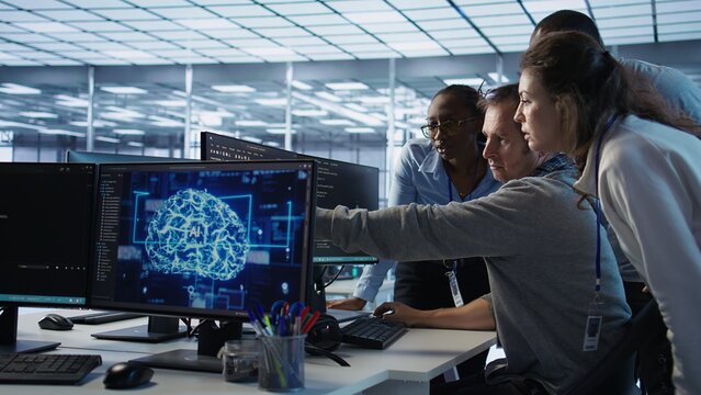 Engineer calling colleagues after finding error in code while doing checkup on server room used for AI workloads. Man requesting help from coworkers after finding bug in data center systems, camera B - Powered by Adobe