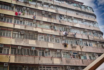 Weathered Apartment Building with Clothes Hanging