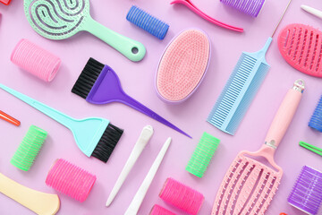 Set of hairdresser's accessories on pink background