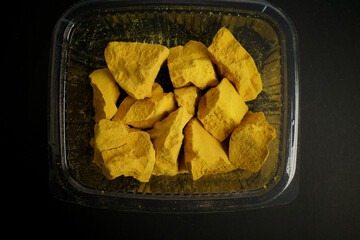 closeup photo of Traditional Iraqi sweets Khareet in a plastic container