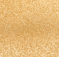 Golden glitter texture background with sequins and sparkles