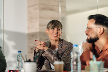 Businesswoman leading office meeting with engaging discussion