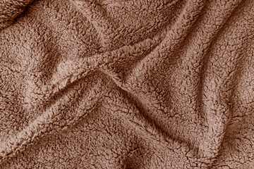 Soft, textured brown fleece fabric texture in color of the year 2025 mocha mousse