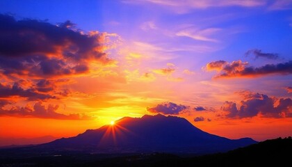 A stunning sunset over a mountain, showcasing vibrant colors in the sky.