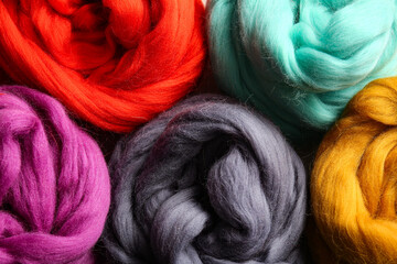 Colorful wool for felting as background, closeup