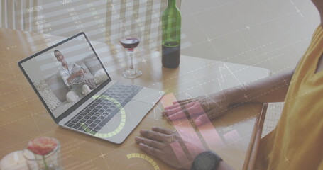 Image of diagrams and data processing over biracial man having image call with friend