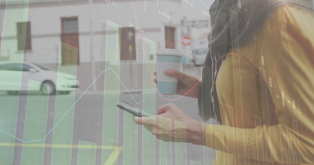 Image of diagrams and data processing over caucasian woman using smartphone in city