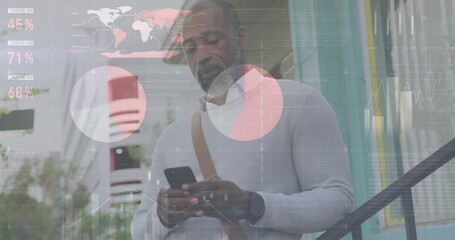 Image of diagrams and data processing over african american man using smartphone in city