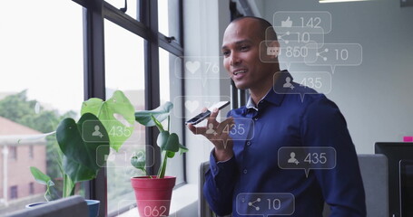 Image of data processing over biracial businessman talking on smartphone in office