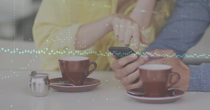 Image of diagrams and data processing over caucasian couple using smartphone