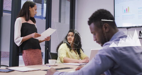 Image of diagrams over diverse colleagues discussing work in office
