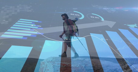 Image of financial data processing over caucasian man hiking in mountains