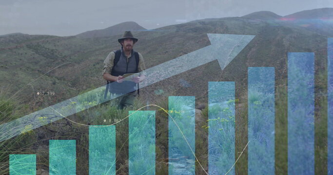 Image of financial data processing over caucasian man hiking in mountains - Powered by Adobe