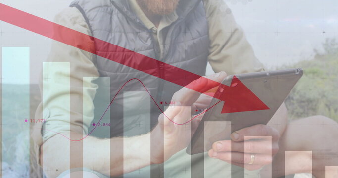 Image of financial data processing over caucasian man using tablet in mountains - Powered by Adobe