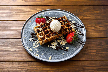 Waffles with Vanilla Ice Cream, Strawberries, and Chocolate