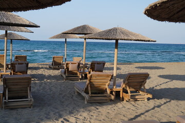 sunbeds and loungechairs on Ammoudara beach , Heraklion 