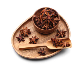 Wooden plate with star anise and scoop on white background