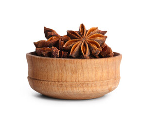Wooden bowl with aromatic star anise on white background