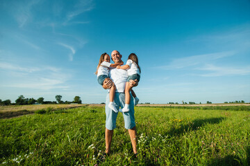 Happy kids dad and mom are kissing and hugging.
