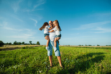 Happy kids dad and mom are kissing and hugging.