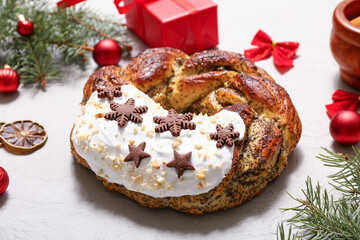Tasty Christmas pastry wreath with fir tree branches, balls and cookies on white background