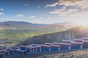 Sunset over the rapeseed fields around Sakya monastery, Western Tibet