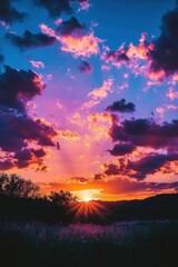 Fototapeta premium A vibrant sunset with colorful clouds illuminating the sky.