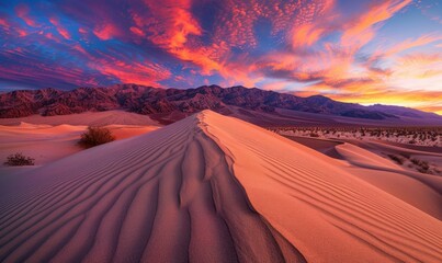 Naklejka premium Stunning desert landscape at sunset with vibrant sky colors.