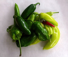 Assorted fresh peppers from garden .