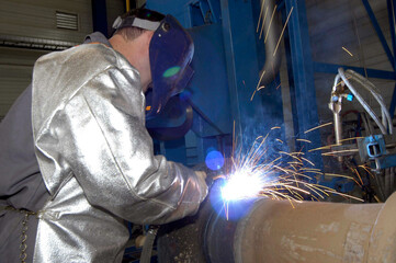 worker welding in protective clothing